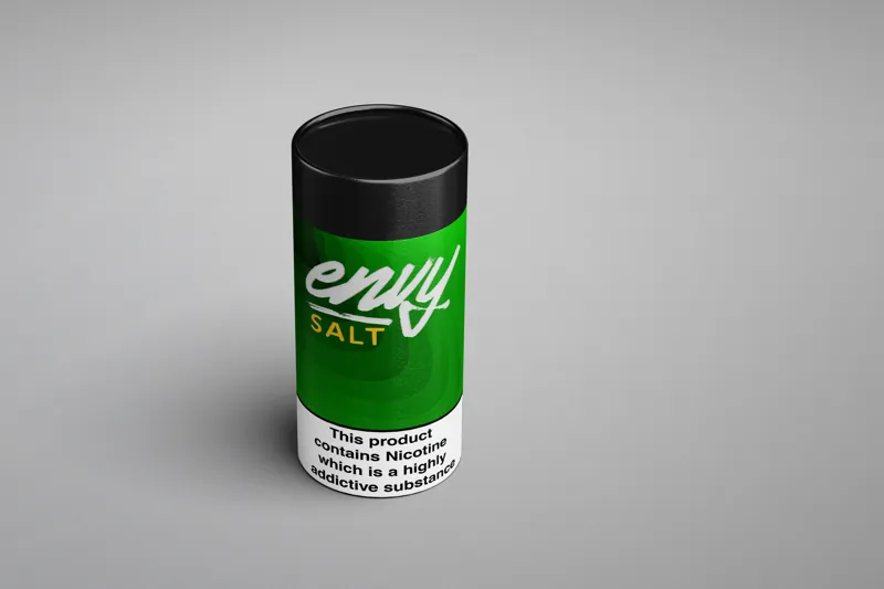 A green cylindrical Envy Salt tube, the brand in white script, with the nicotine warning on a white panel.
