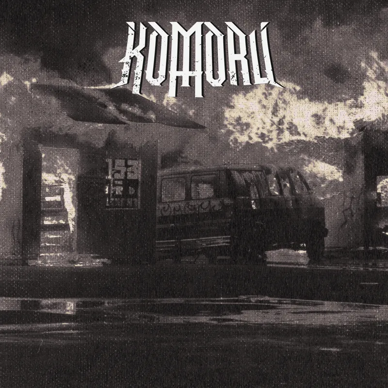 An EP cover: the KOMORU lettering in white over a grainy black and white photograph of a burnt-out building.